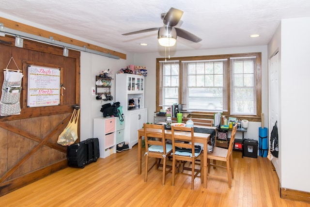 dining room featuring ceiling fan and light hardwood / wood-style floors