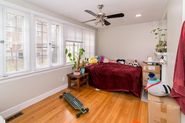 bedroom with hardwood / wood-style floors and ceiling fan