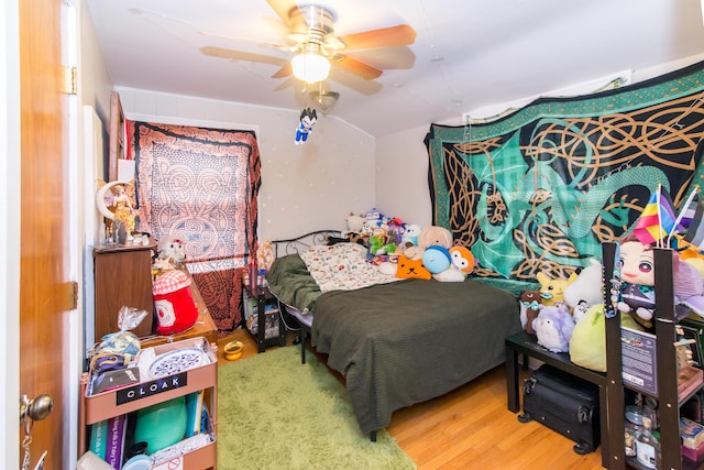 bedroom featuring hardwood / wood-style floors and ceiling fan