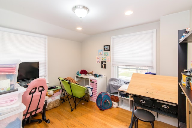 office area with lofted ceiling and hardwood / wood-style flooring