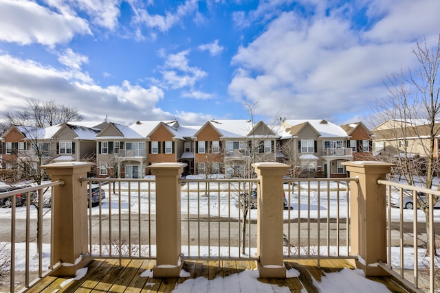 view of snow covered gate