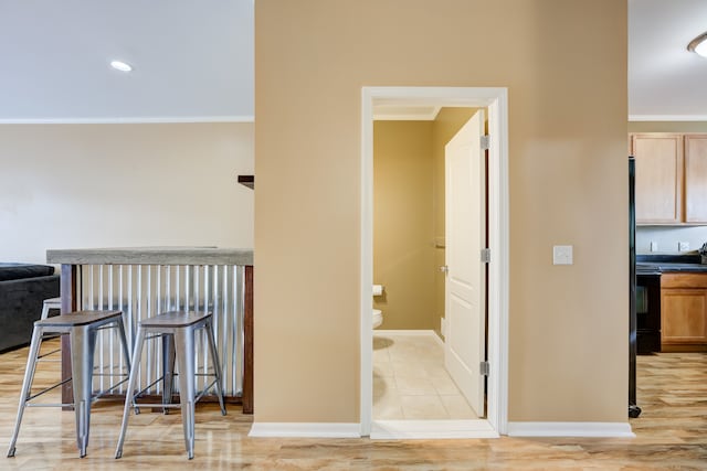 hall featuring ornamental molding