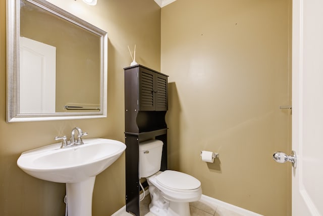 bathroom with tile patterned floors, toilet, and sink