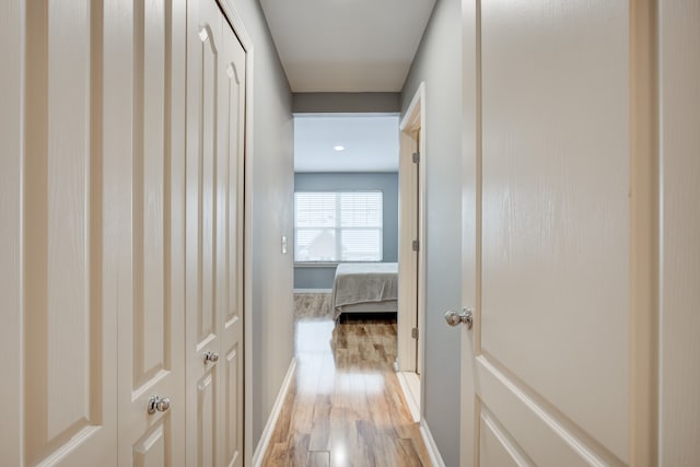 hallway with light wood-type flooring