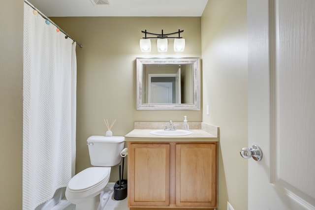 bathroom featuring tile patterned floors, vanity, toilet, and curtained shower