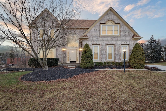 view of front of home with a lawn