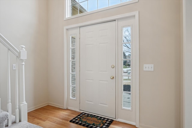 entryway with light hardwood / wood-style flooring