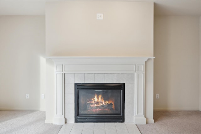 room details featuring carpet floors and a tiled fireplace