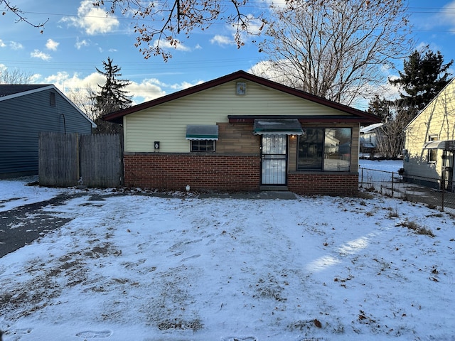 view of snow covered house