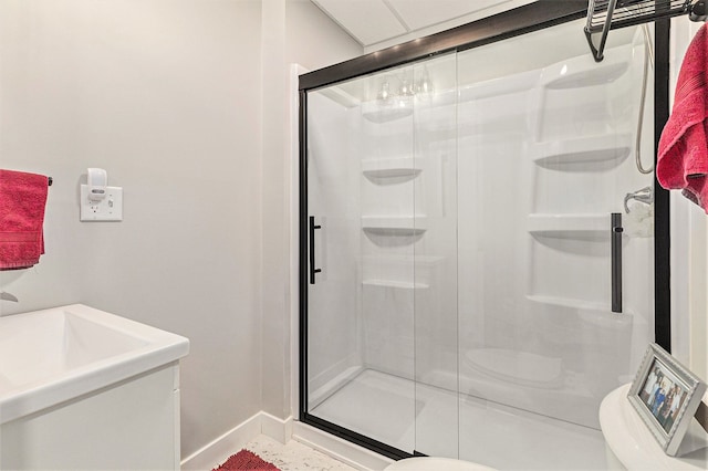 bathroom with toilet and a shower with shower door