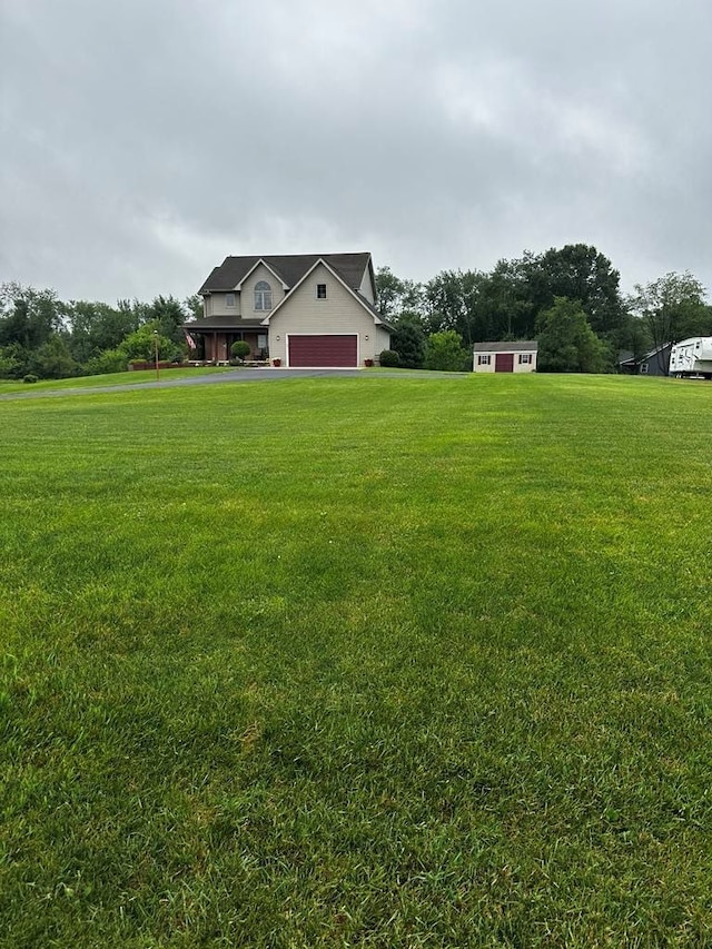 view of yard featuring a garage