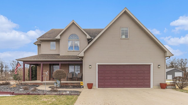 view of front of home with a garage and covered porch