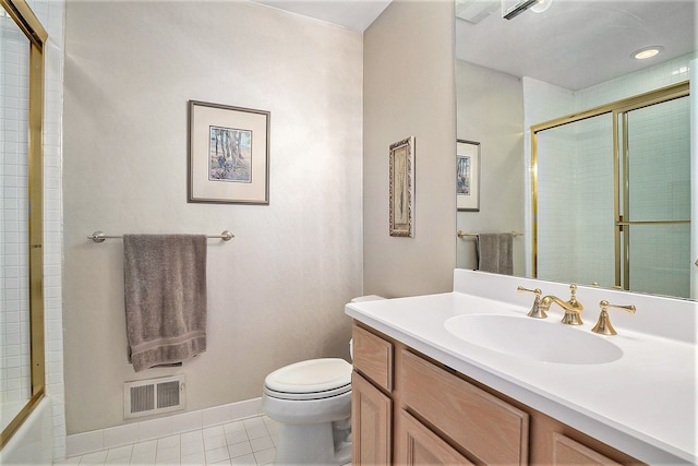 full bathroom featuring bath / shower combo with glass door, toilet, vanity, and tile patterned flooring