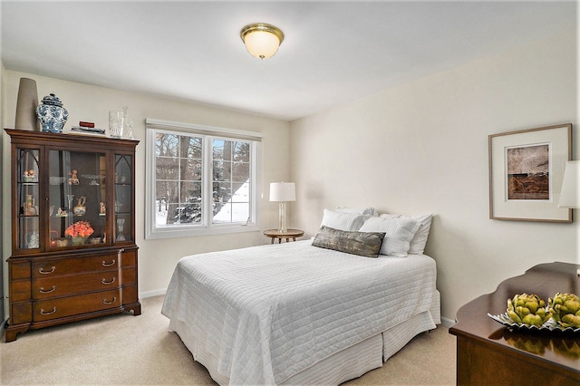 bedroom with light colored carpet