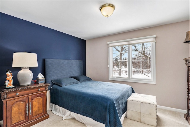 bedroom featuring light colored carpet