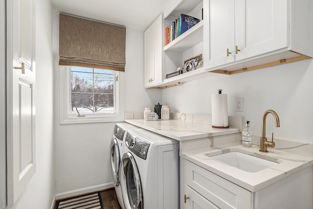 washroom with washer and dryer, cabinets, sink, and dark wood-type flooring