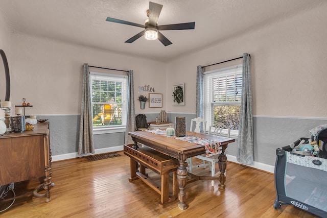 office space with ceiling fan, wood-type flooring, and a textured ceiling