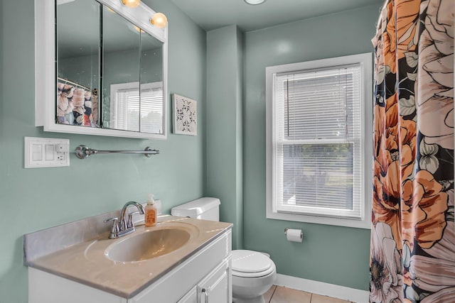 bathroom featuring tile patterned flooring, vanity, a shower with shower curtain, and toilet