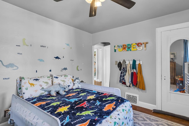 bedroom featuring hardwood / wood-style flooring and ceiling fan