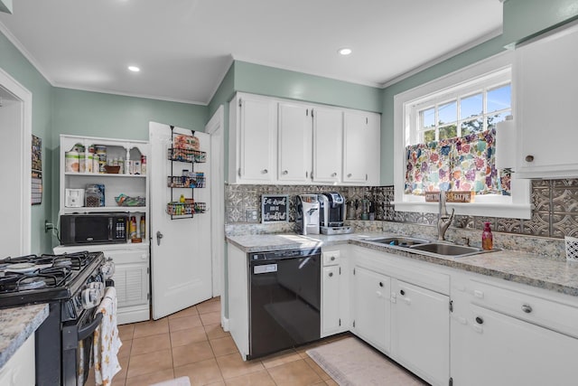 kitchen featuring sink, backsplash, black appliances, and white cabinets