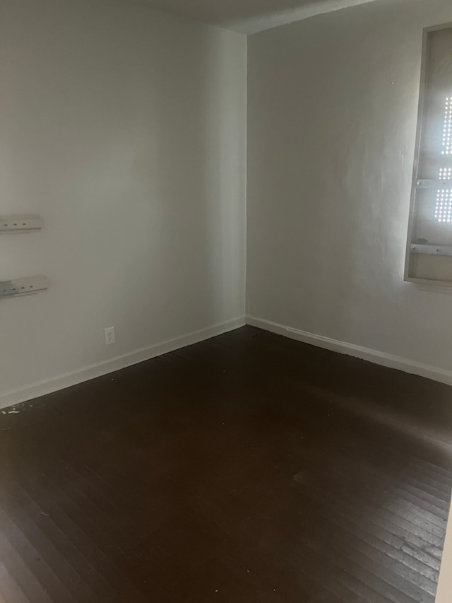 unfurnished room featuring hardwood / wood-style floors