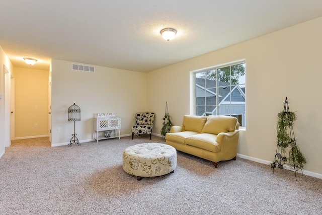 living area featuring carpet