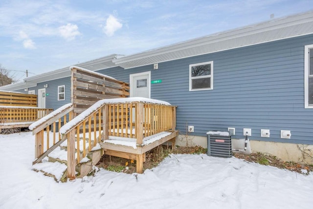 exterior space with a deck and central AC