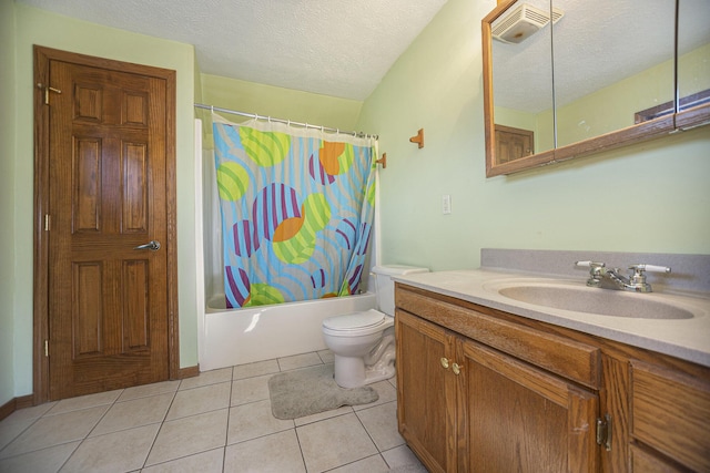 full bathroom with vanity, tile patterned floors, shower / bath combination with curtain, toilet, and a textured ceiling