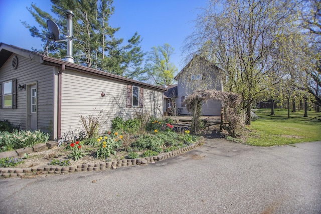 view of side of home featuring a yard