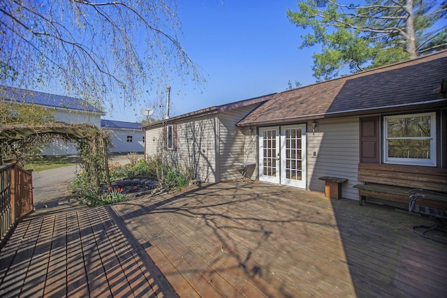 view of patio featuring a wooden deck and french doors