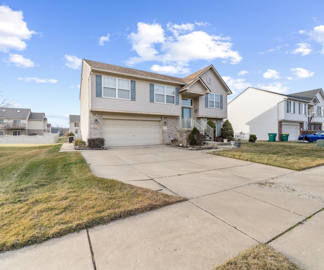 bi-level home featuring a front yard and a garage