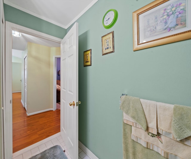 bathroom featuring tile patterned flooring and ornamental molding