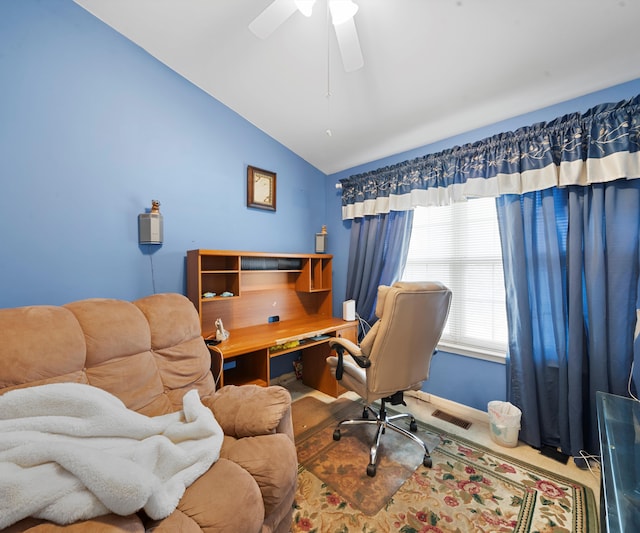 office area with carpet, vaulted ceiling, and ceiling fan