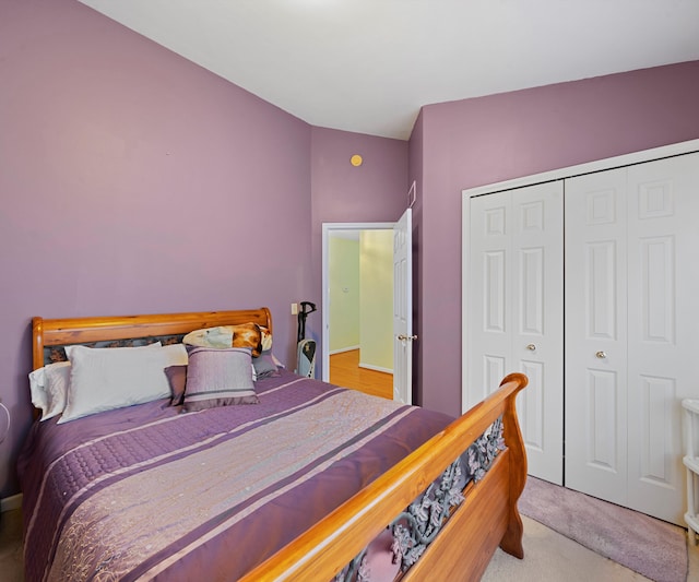 carpeted bedroom with a closet