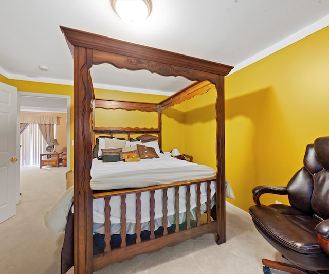 carpeted bedroom featuring ornamental molding