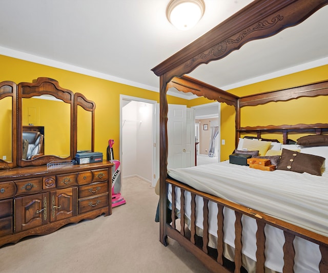 carpeted bedroom with ornamental molding