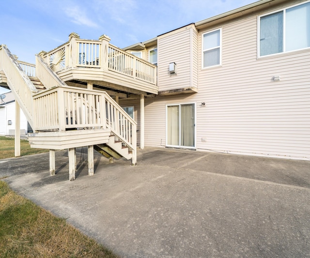 back of house featuring a wooden deck