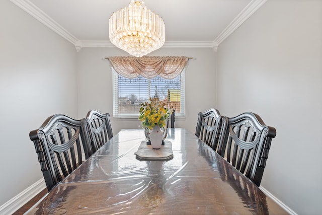 dining room with crown molding and an inviting chandelier