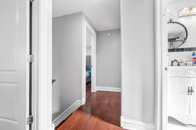 bathroom with wood-type flooring and sink