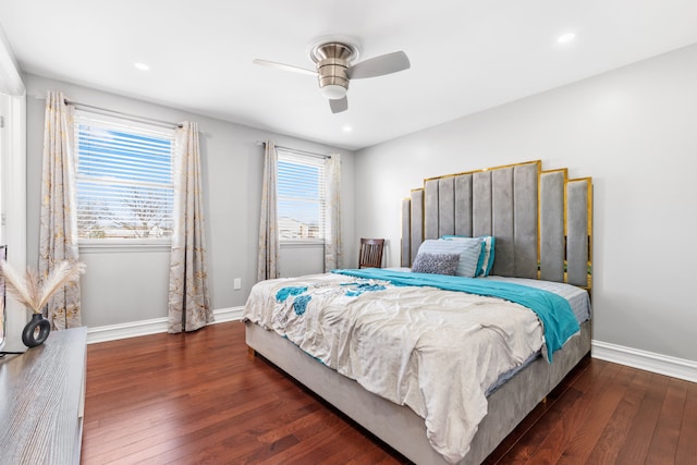 bedroom with multiple windows, ceiling fan, and dark wood-type flooring