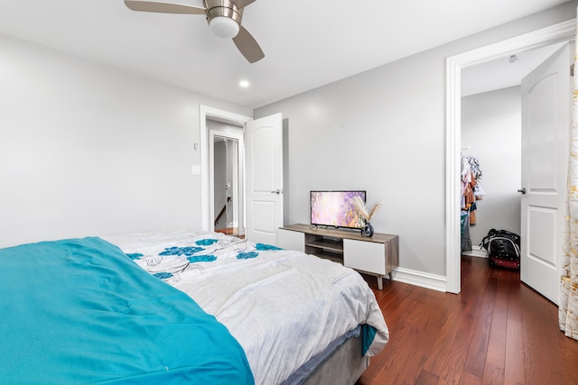 bedroom with ceiling fan and dark wood-type flooring