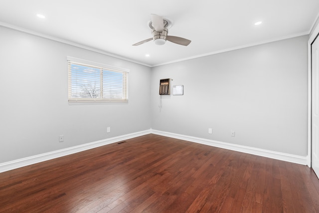 empty room with ceiling fan, hardwood / wood-style floors, and ornamental molding