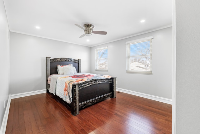 bedroom featuring hardwood / wood-style floors, ceiling fan, and crown molding