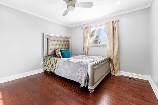 bedroom featuring ceiling fan, dark wood-type flooring, and ornamental molding