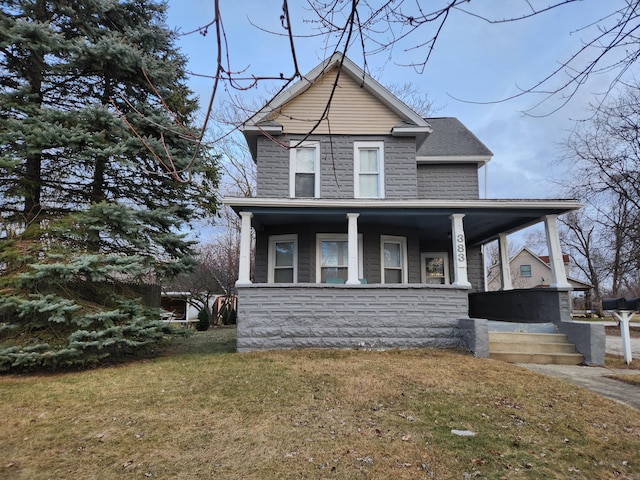 view of front facade featuring a front yard and a porch