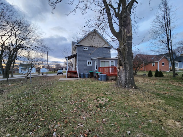 rear view of house with a lawn