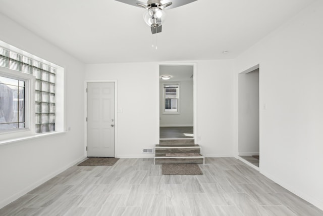 interior space featuring ceiling fan