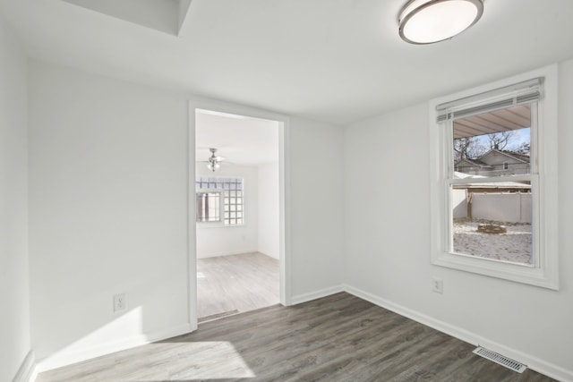 spare room with ceiling fan and hardwood / wood-style floors