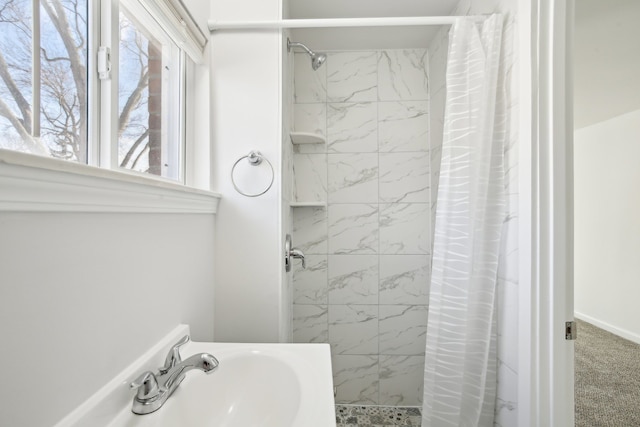 bathroom featuring sink and walk in shower