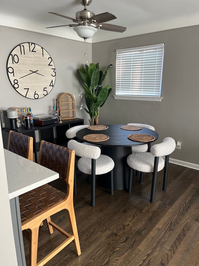 dining room with dark wood-type flooring and ceiling fan